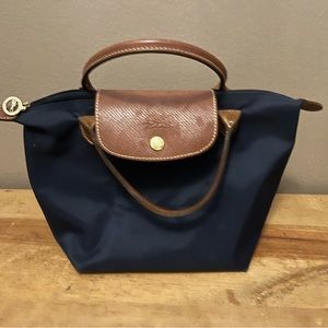 Longchamp
Le Pliage Small Top Handle Bag